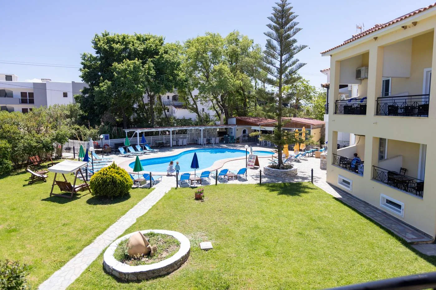 Studios overlooking the green garden and pool