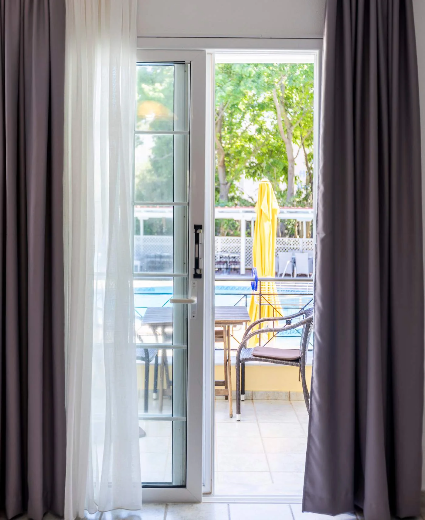 Studio doors opening onto a balcony