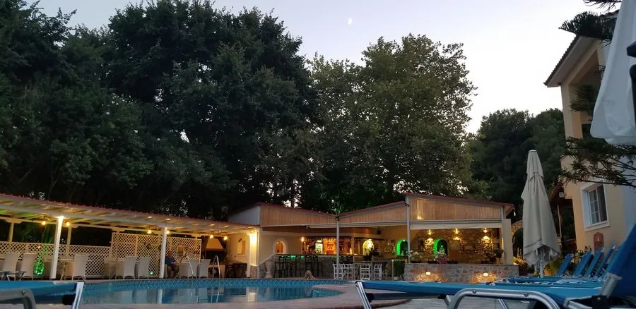 Pool bar and garden at dusk