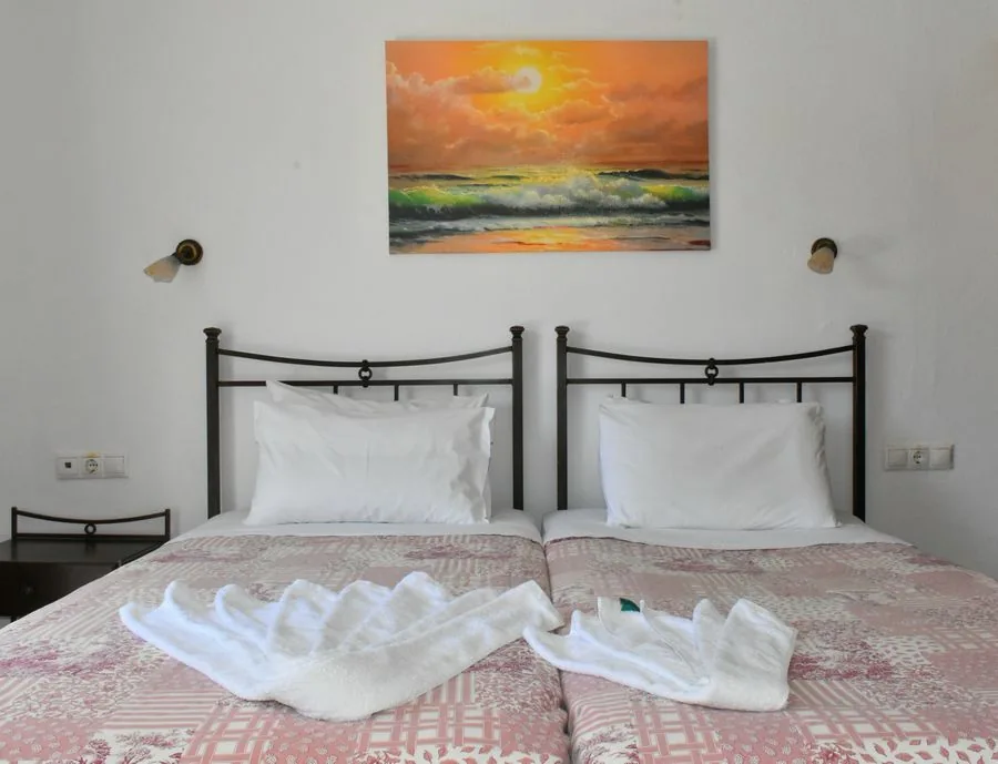 Double bed in a bright studio