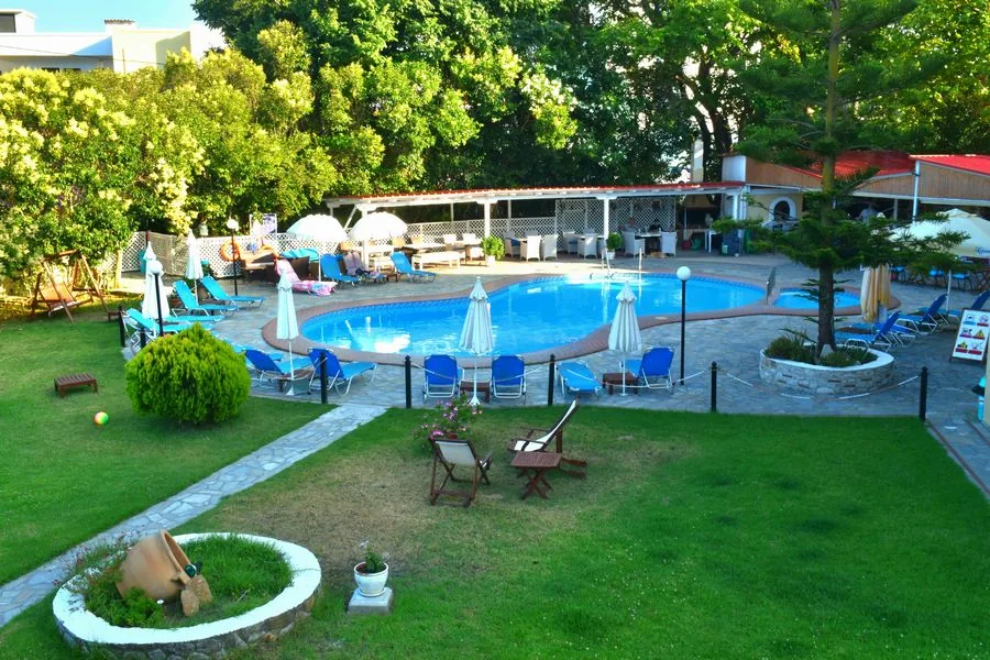 Pool area surrounded by greenery