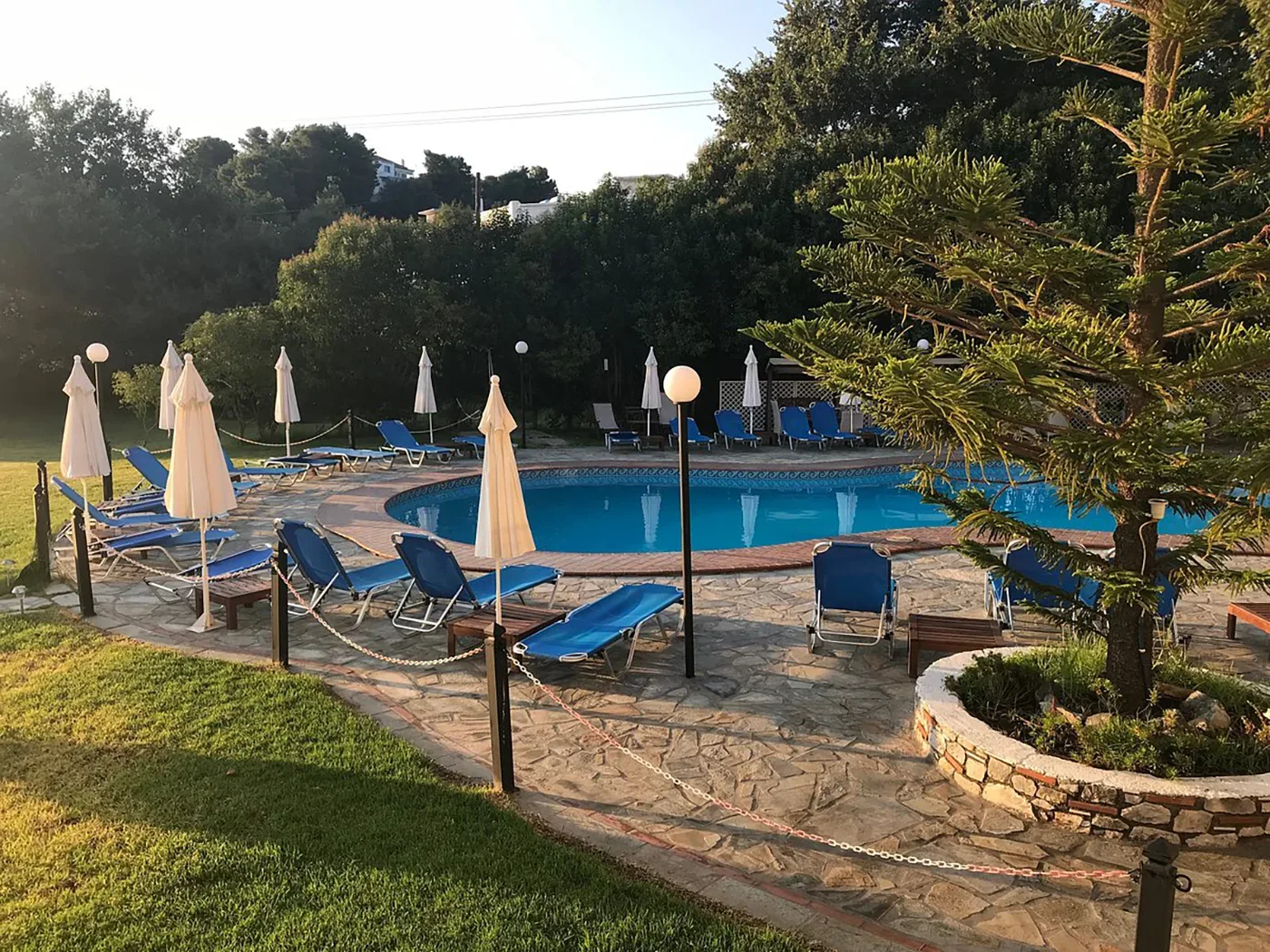 Sun umbrellas alongside the swimming pool