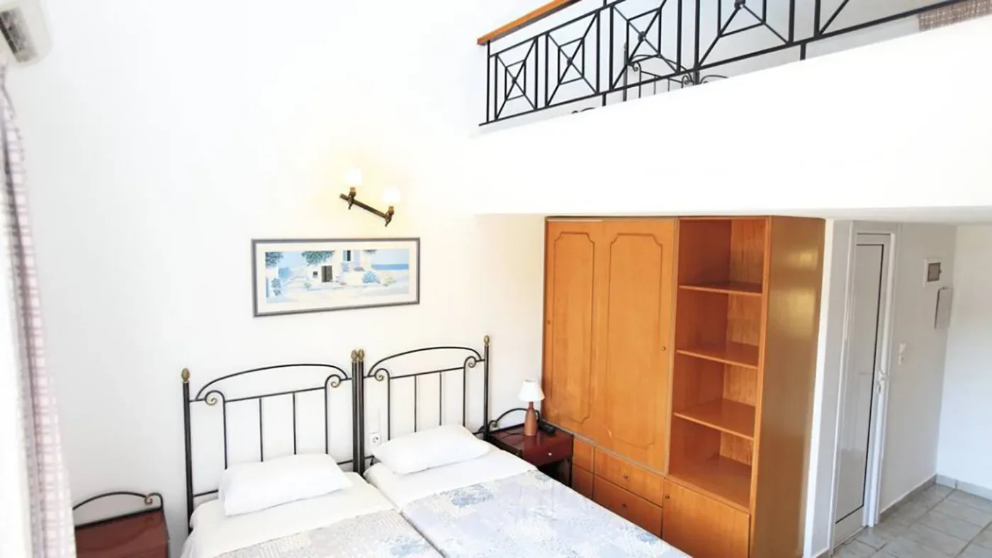 Twin studio with wooden wardrobe