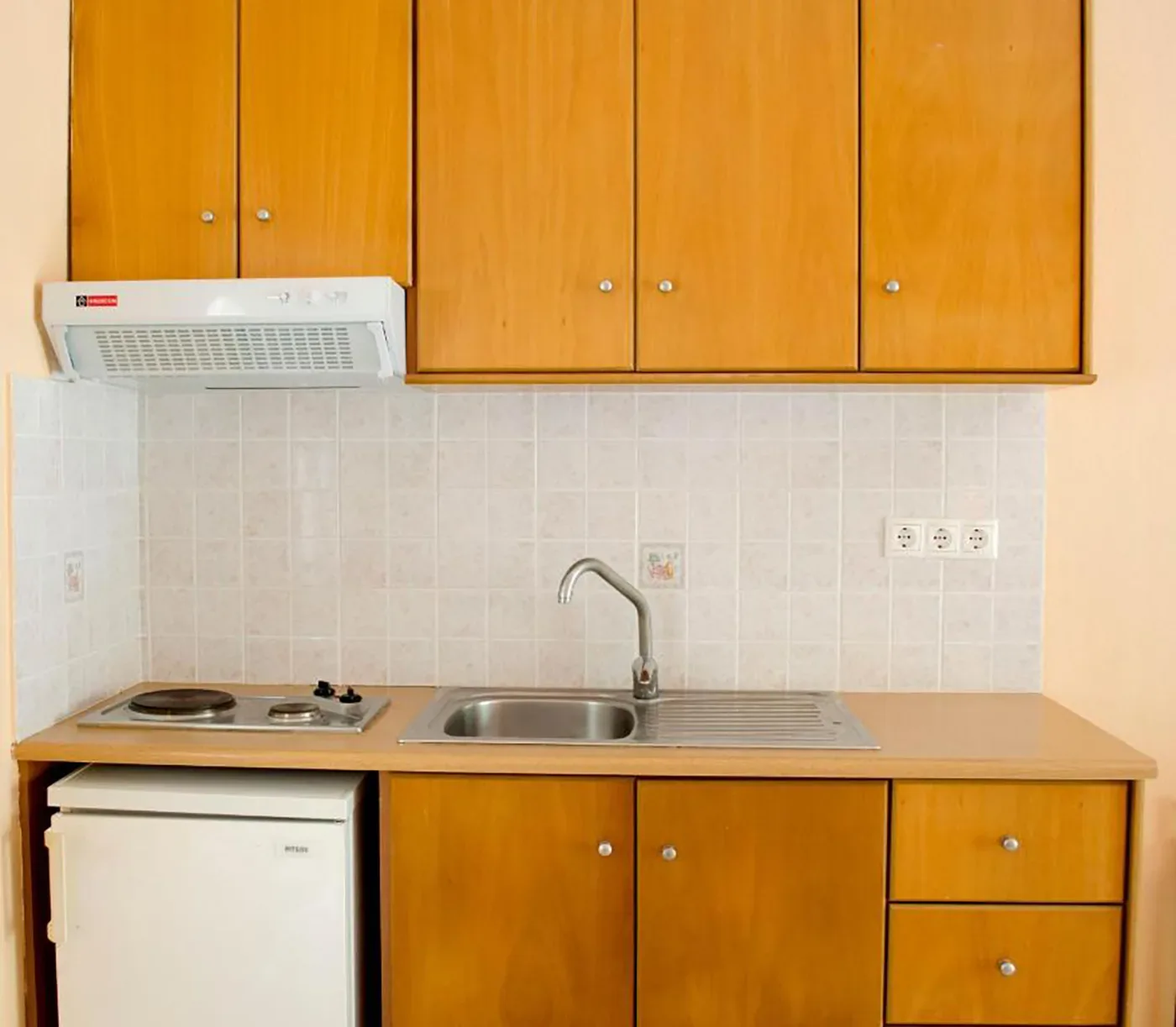 Kitchenette with wooden cupboards
