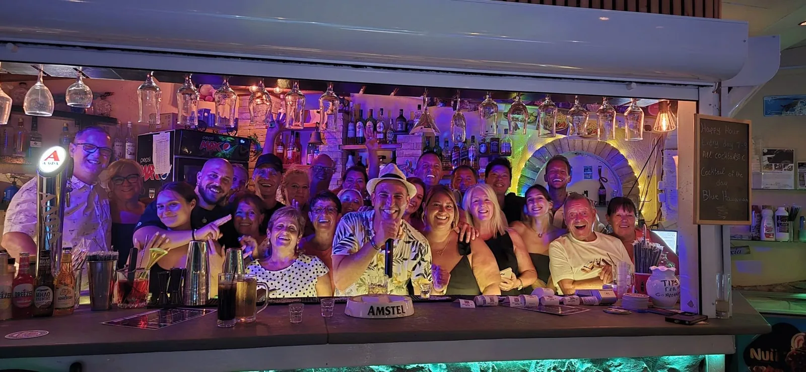 Guests enjoying an evening together at the open Edem Studios pool bar